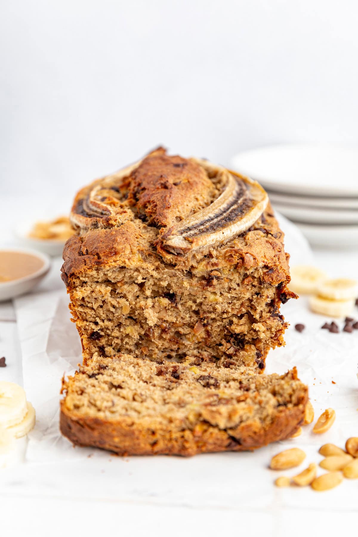A freshly baked loaf of vegan peanut butter banana bread, sliced.