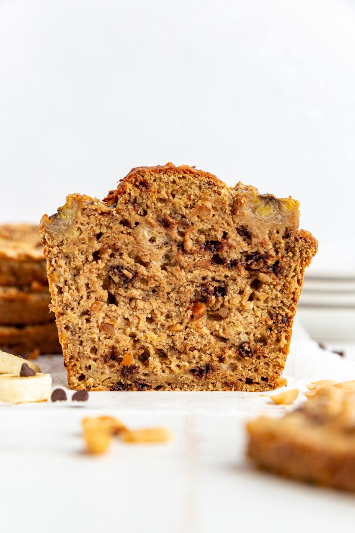 A loaf of peanut butter banana bread, sliced in half.