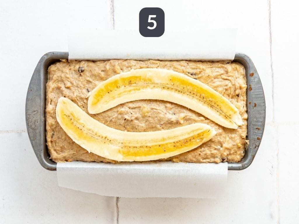 Vegan Peanut Butter Banana Bread Step 5 - transfer to a loaf pan and top with a halved banana.
