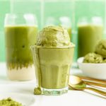 A glass filled with vegan matcha ice cream dripping down the sides.