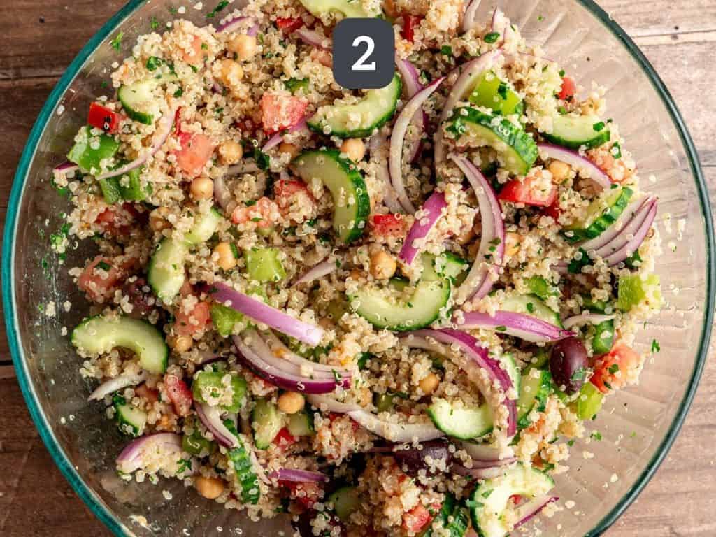 Mediterranean quinoa salad step 2 - toss all the ingredients.