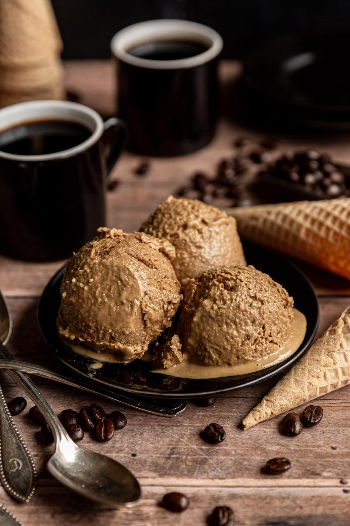 Three scoops of Vegan Coffee Ice Cream on a plate.