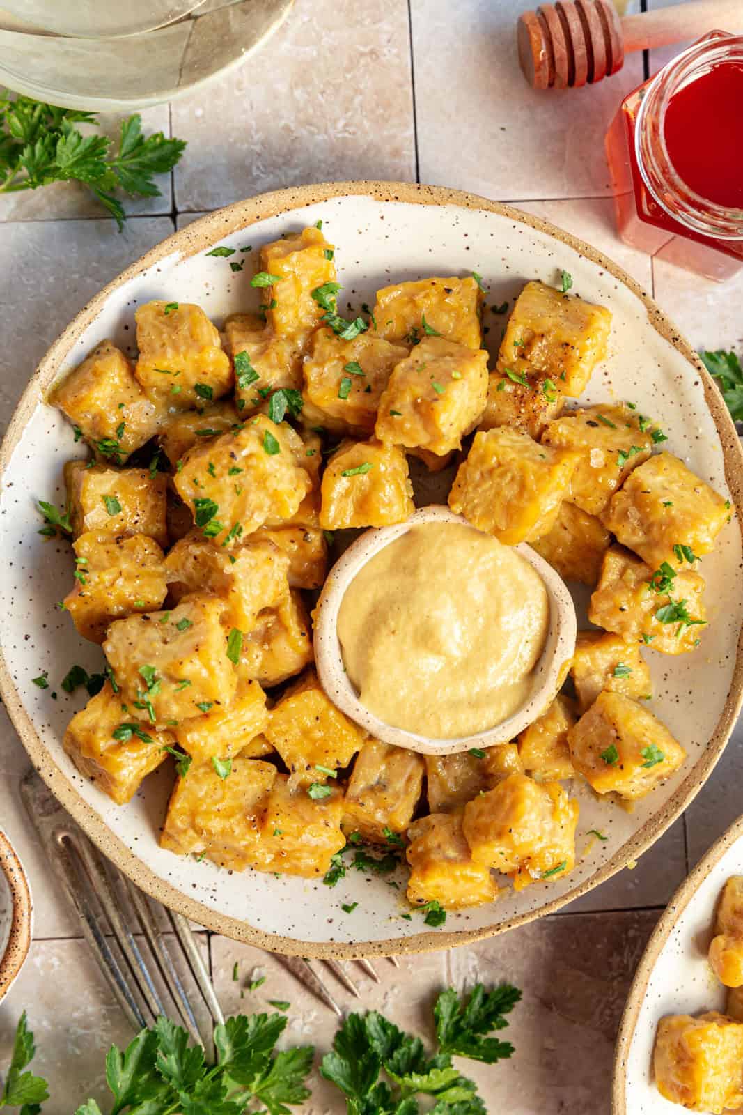 Vegan Honey Mustard Tempeh in a bowl with a sprinkle of parsley.