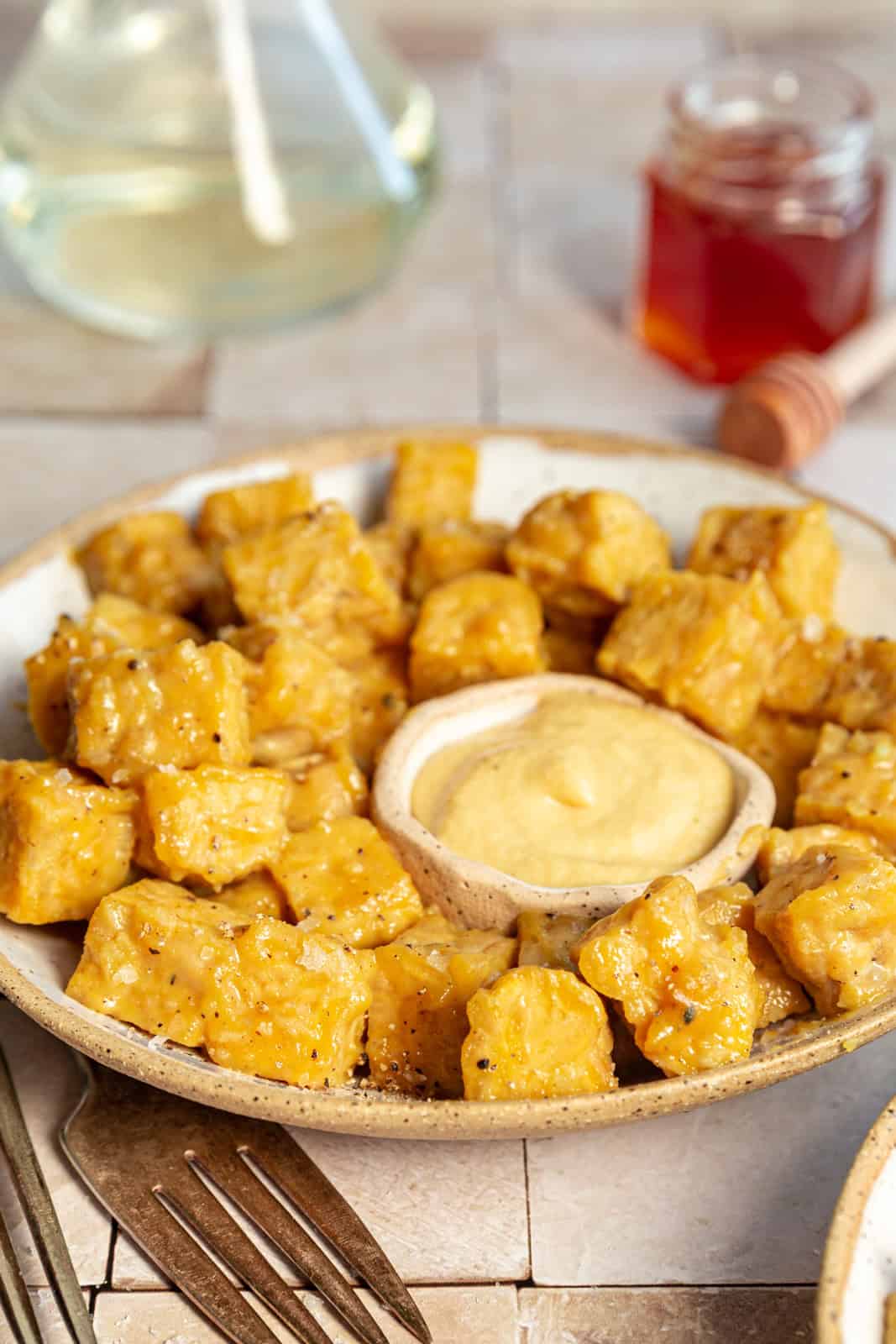 Vegan Honey Mustard Tempeh served with mustard.
