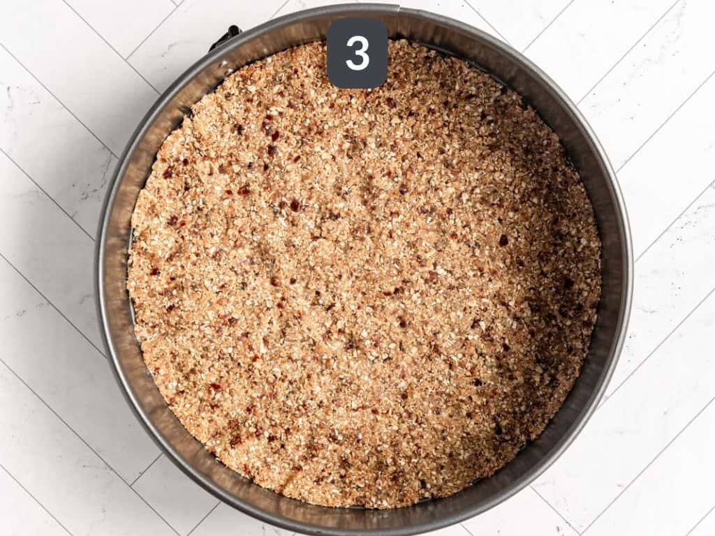Vegan Peanut Butter Cheesecake Step 3 - press crust into a springform pan.