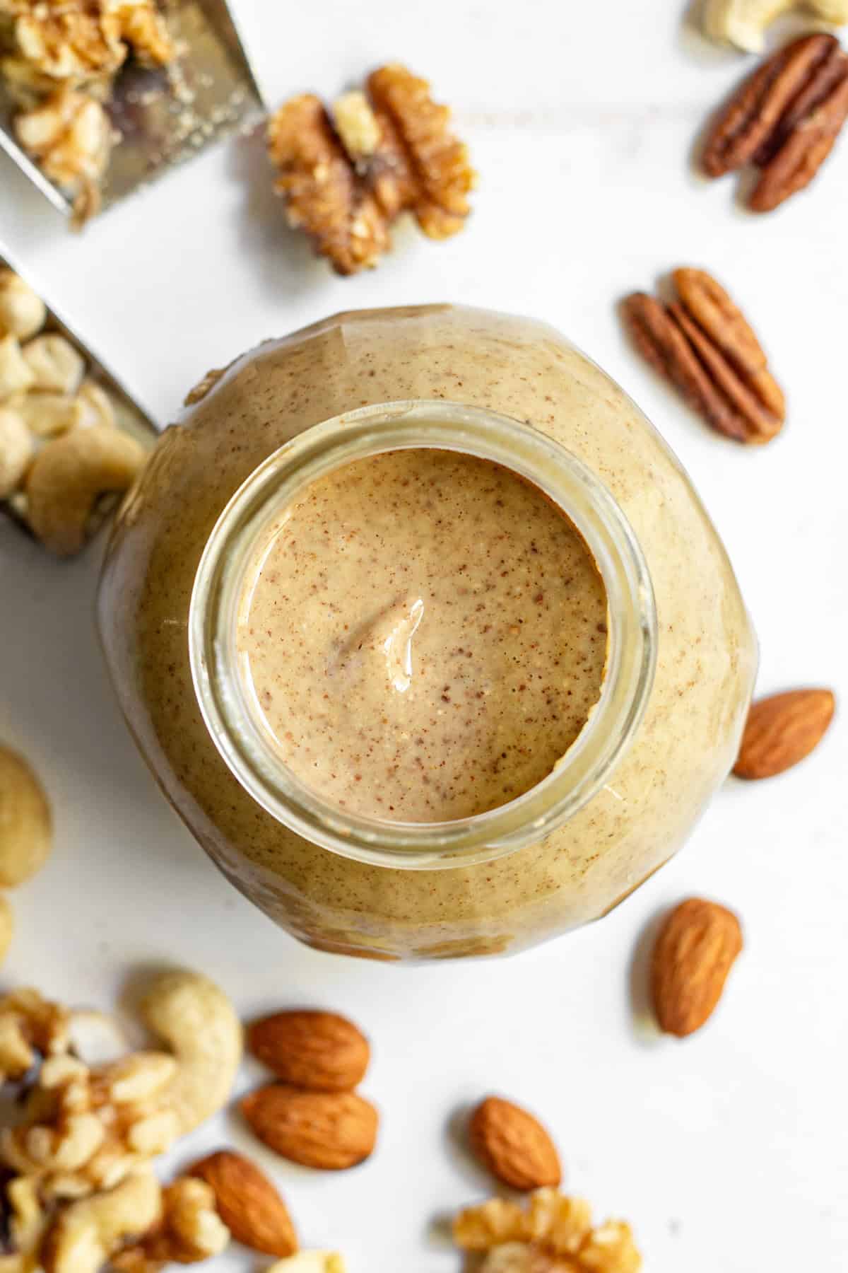 An open jar of mixed nut butter.