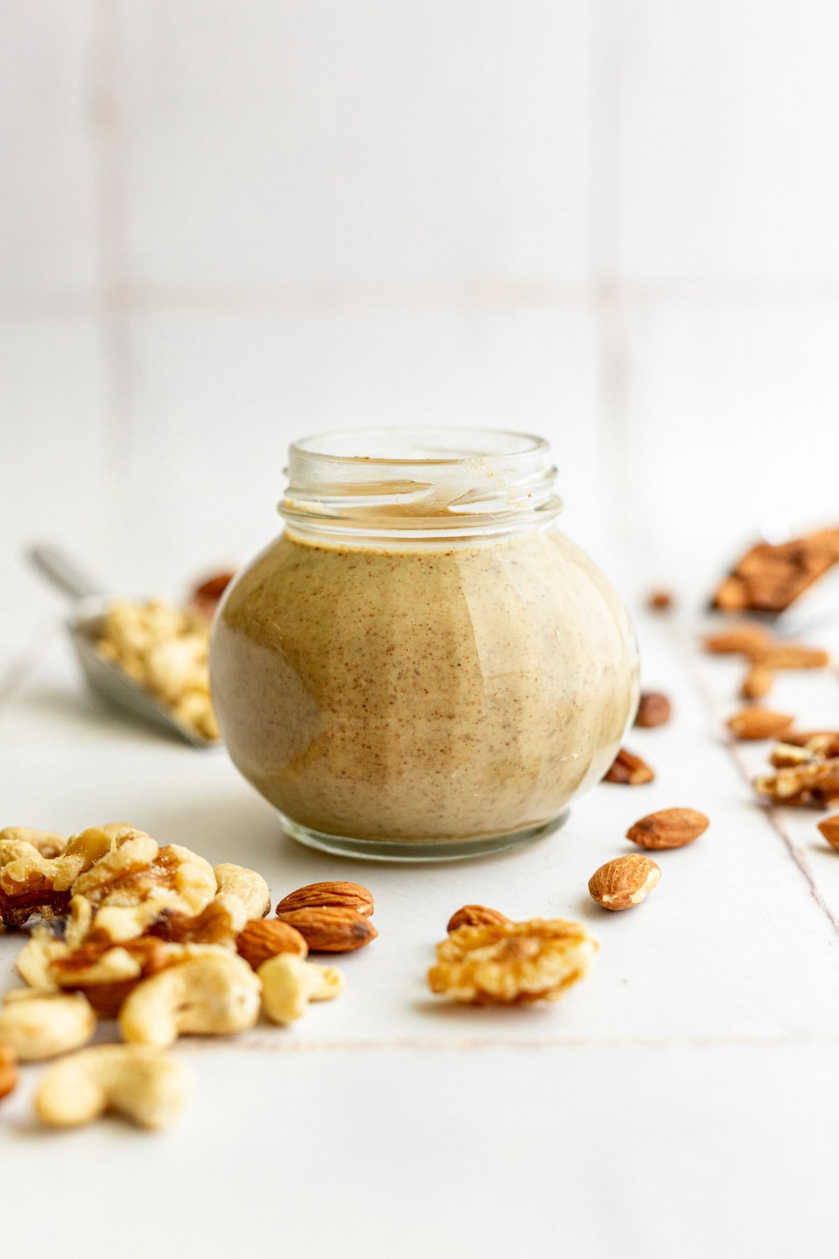 A jar of mixed nut butter, ready to serve.