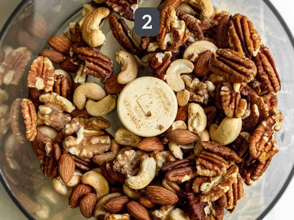 Mixed nut butter step 2 - transfer the nuts to a food processor.