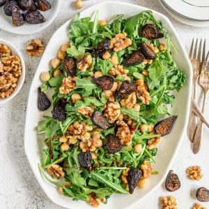 A tray of arugula fig salad.