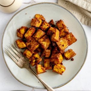 A plate of baked spiced tofu.