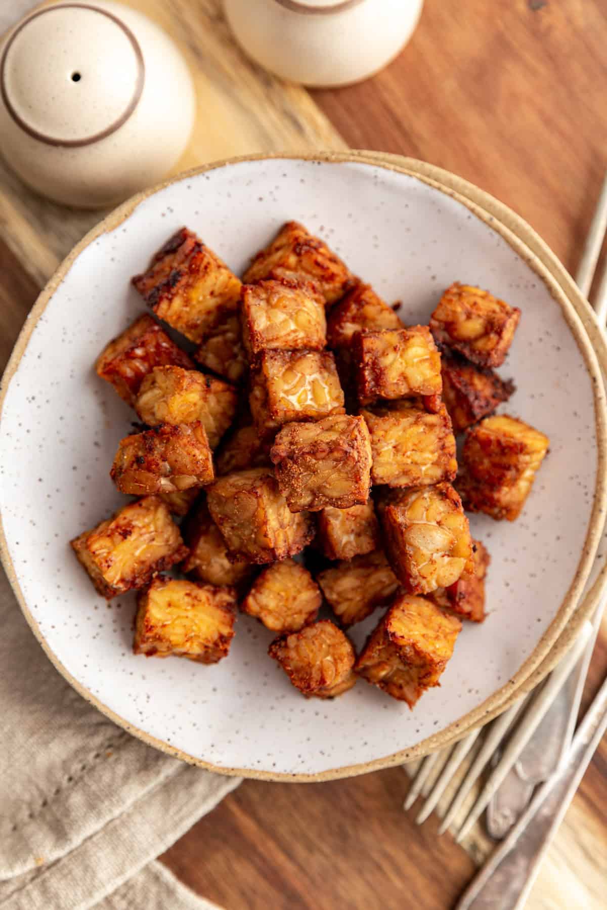 A plate of crispy baked tempeh.