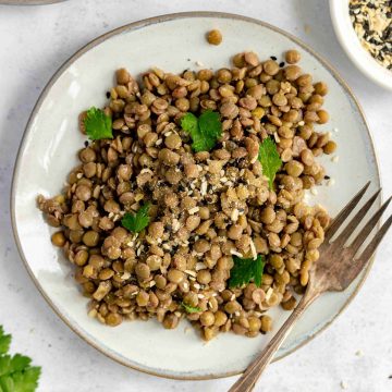 A plate of cooked lentils.
