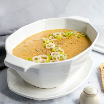 A bowl of vegan potato leek soup.