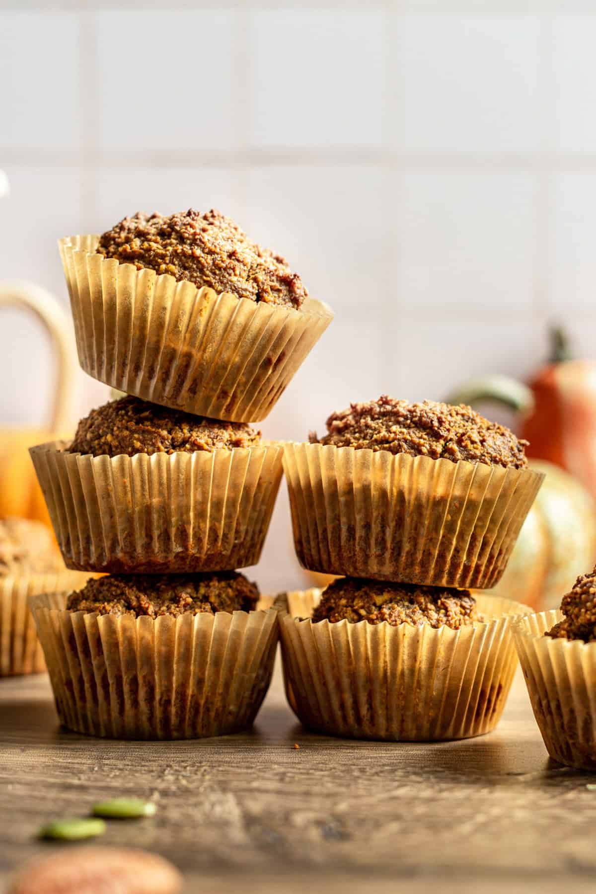 Two stacks of vegan pumpkin muffins.