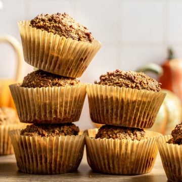 Two stacks of vegan pumpkin muffins.