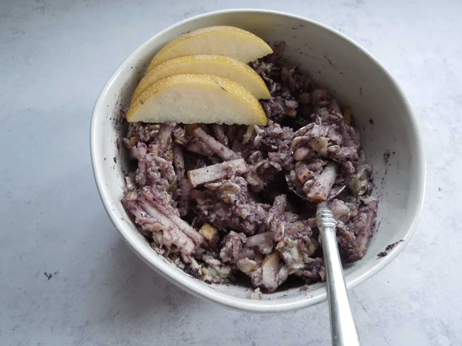 A bowl of purple pear oatmeal.