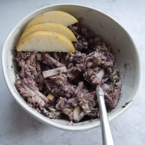 A bowl of purple pear oatmeal.