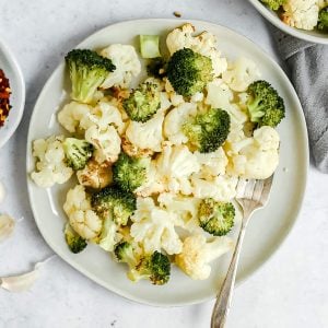 A plate of roasted broccoli and cauliflower.