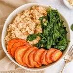 A bowl of oats, spinach, and sweet potato.