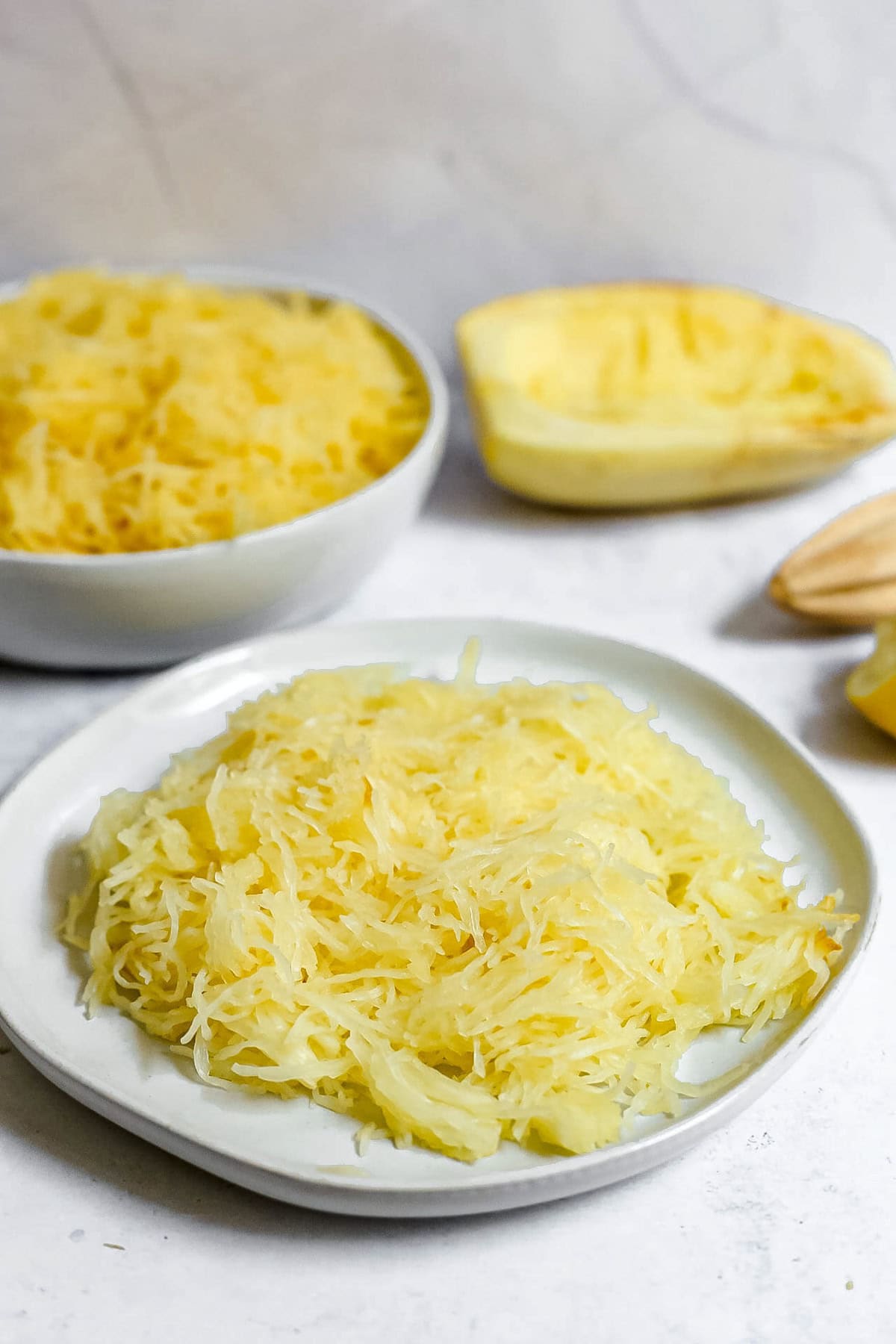 A plate of cooked spaghetti squash.