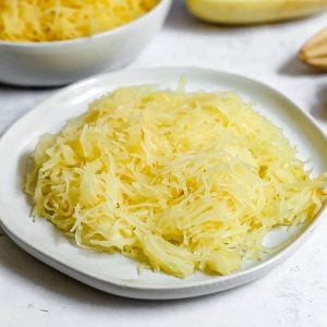 A plate of cooked spaghetti squash.