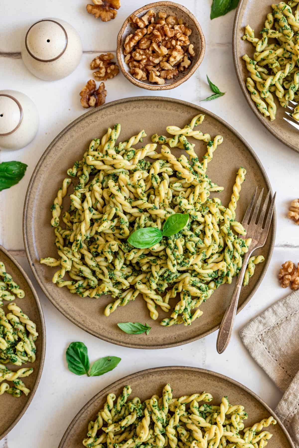 A plate of spinach walnut pesto pasta.