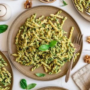 A plate of spinach walnut pesto pasta.