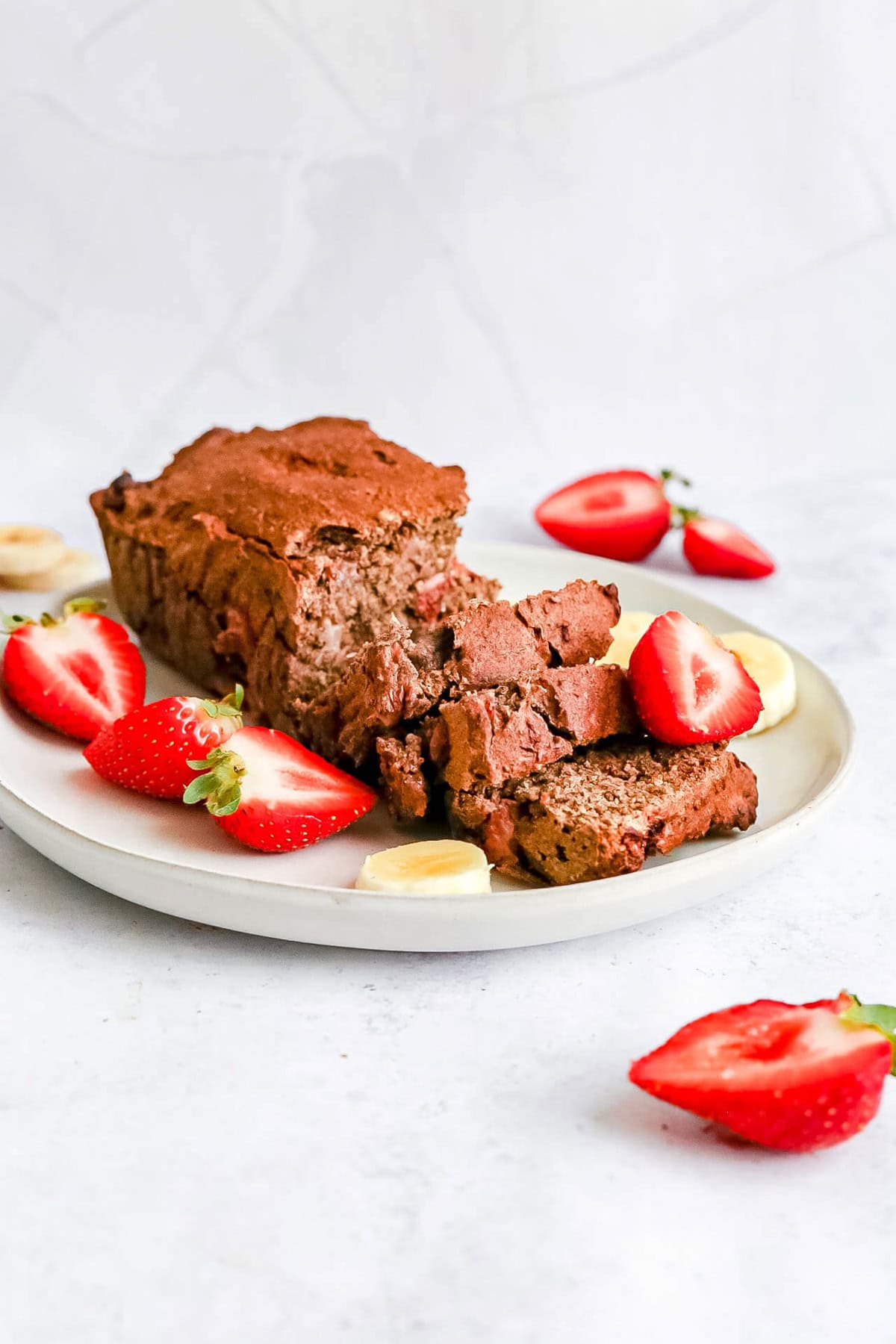 A plate of strawberry buckwheat banana bread sliced.