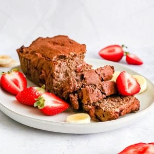 A plate of strawberry buckwheat banana bread sliced.