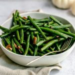 A bowl of sweet glazed green beans.