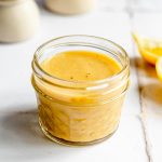 A jar of vegan honey mustard dressing.