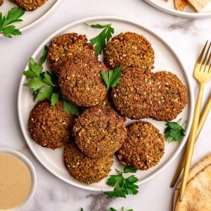 A plate of tofu falafel garnished with fresh parsley.