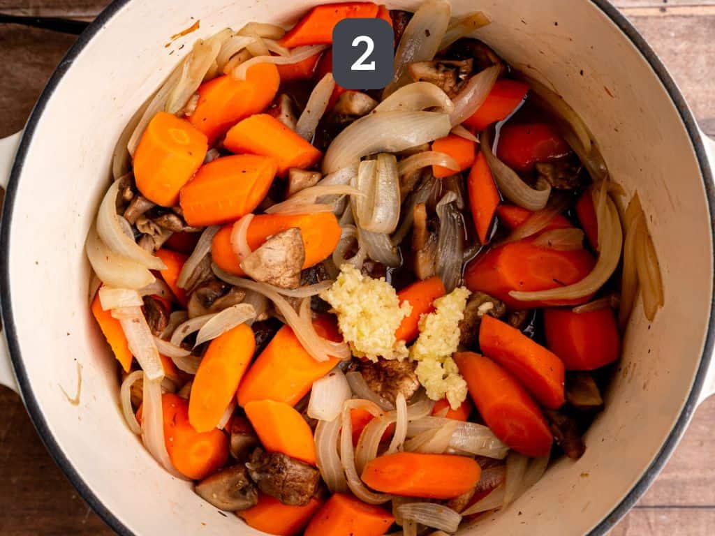 Vegan beef bourguignon step 2 - add the garlic.