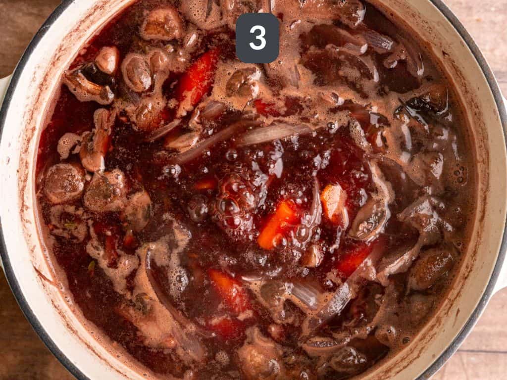 Vegan beef bourguignon step 3 - add the wine and broth.