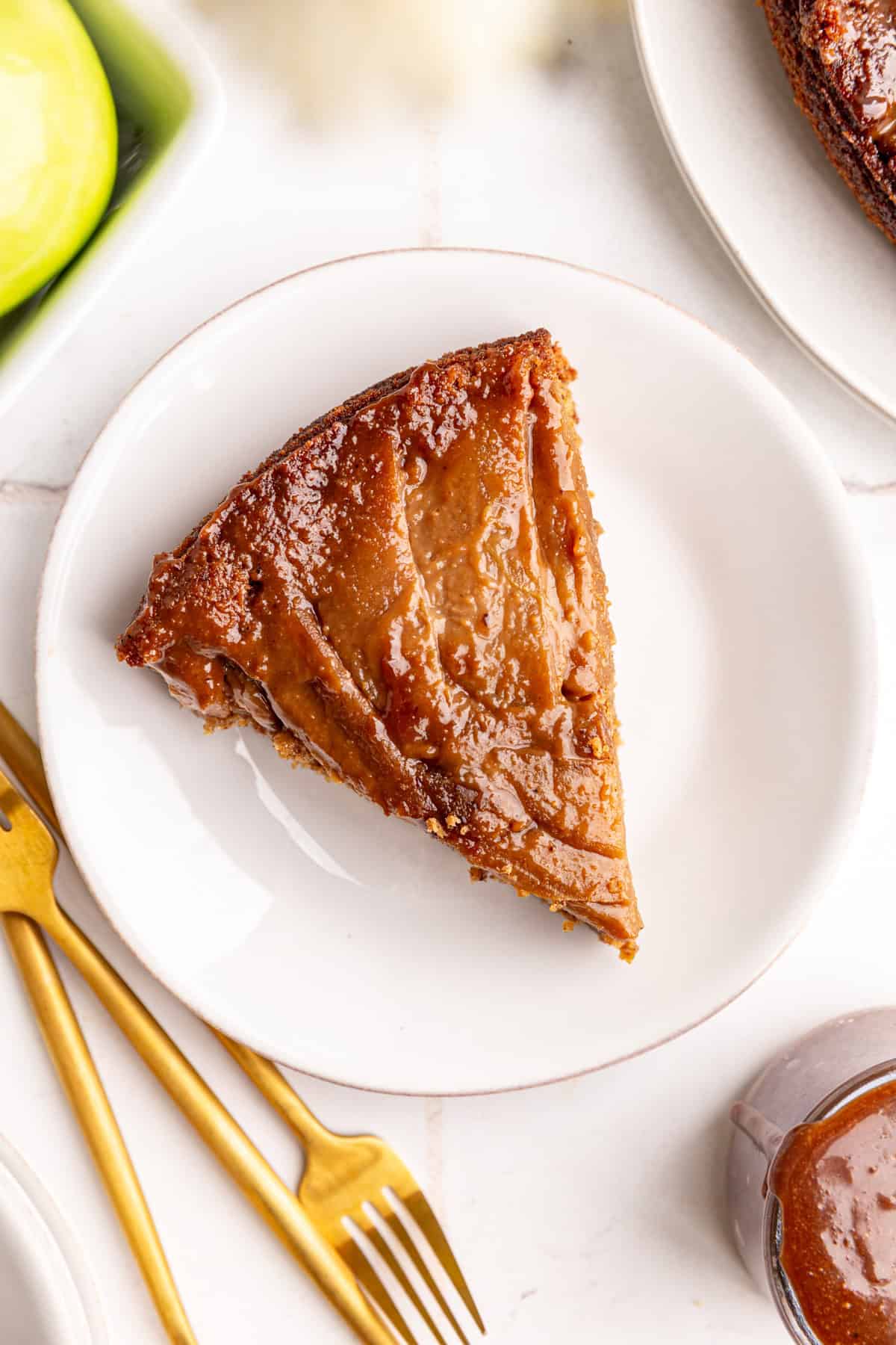 A slice of vegan apple upside down cake.