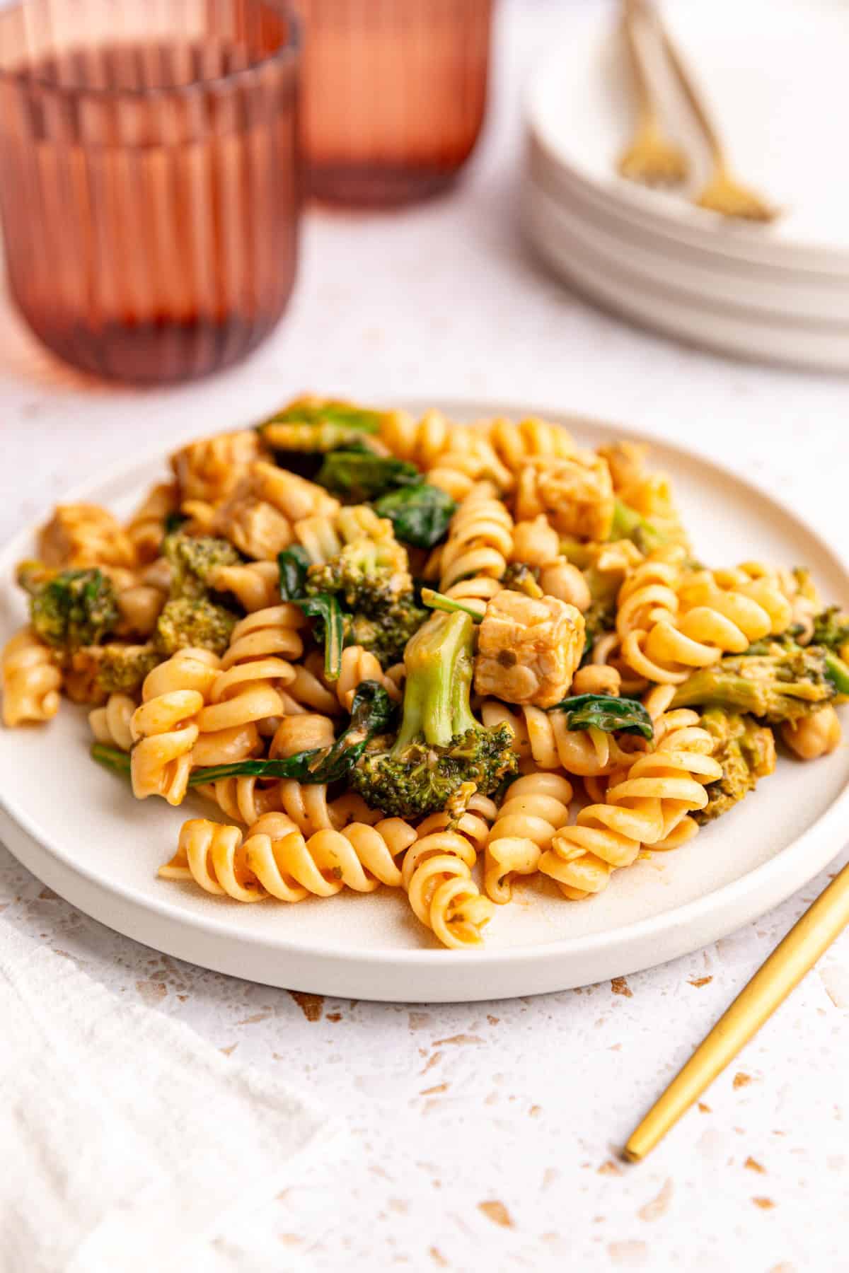 A plate of creamy spinach pasta, ready to eat.