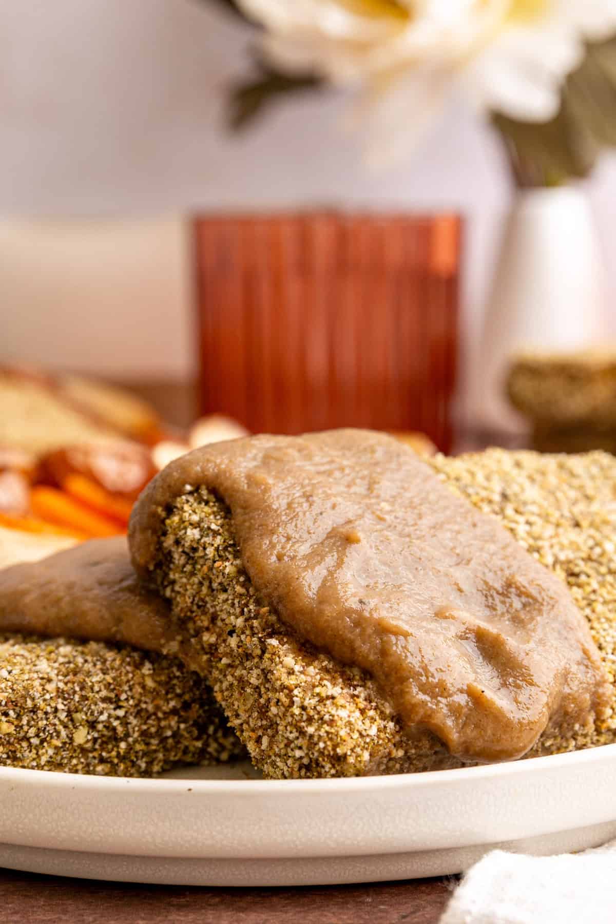 Two pieces of thanksgiving tofu, dripping with gravy.