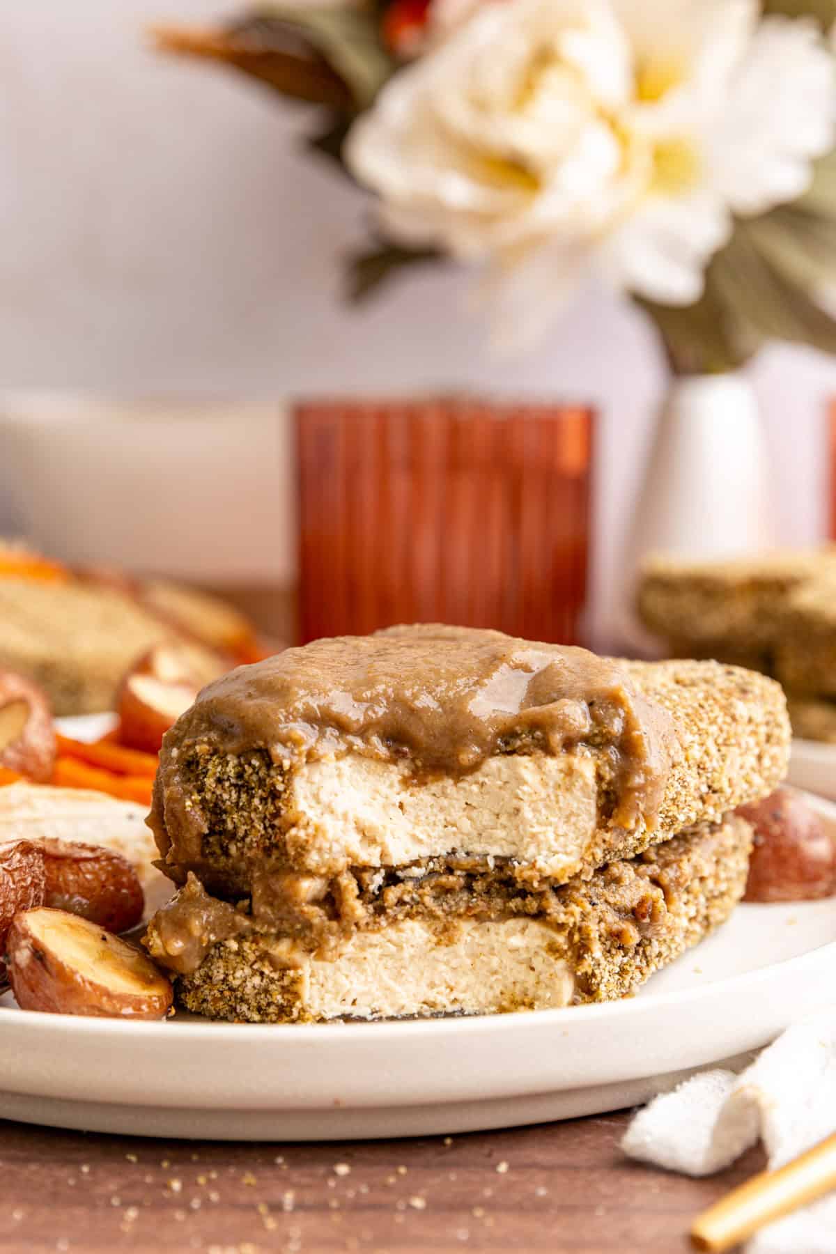 Two pieces of thanksgiving tofu, with a bite taken out.