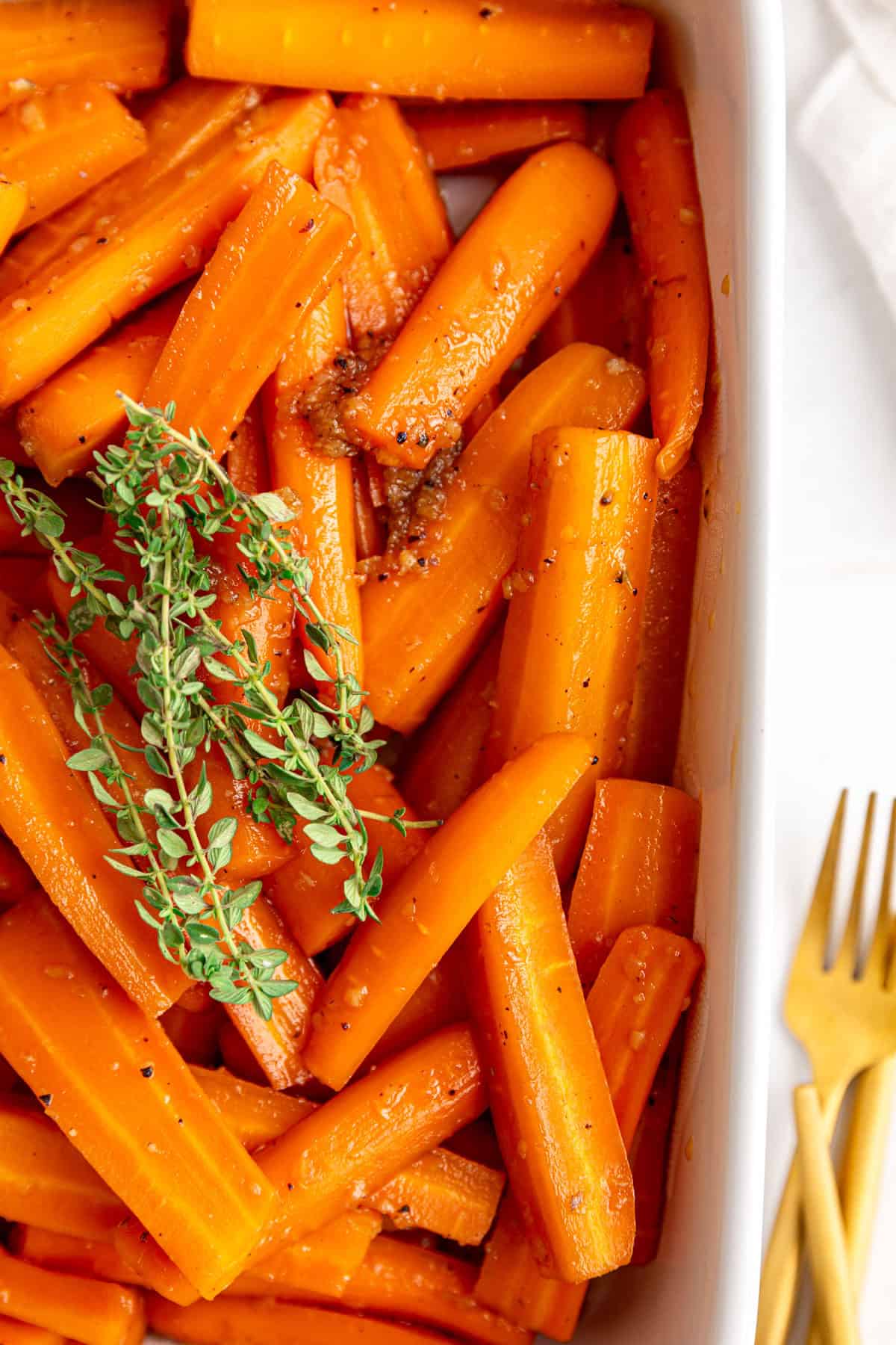A baking dish of glazed carrots.