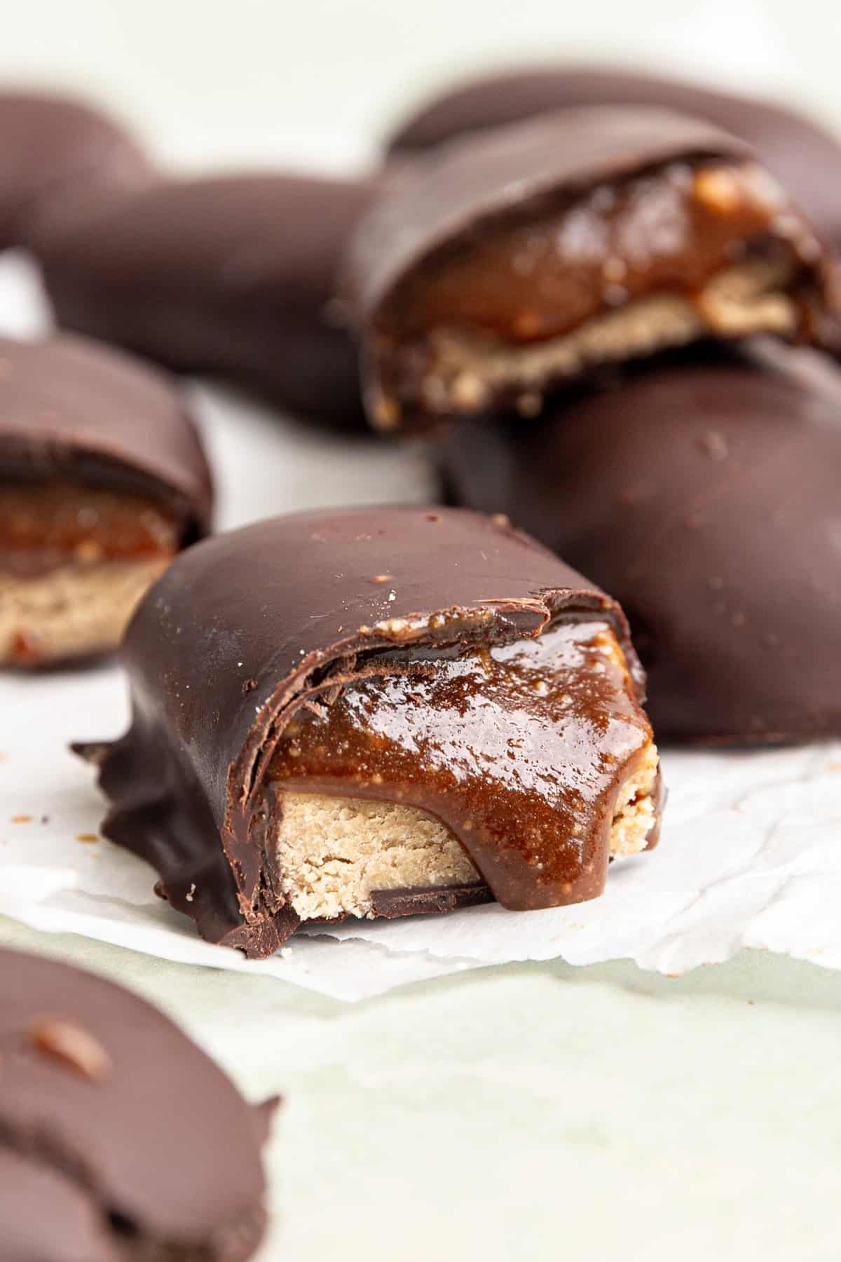 A vegan milky way bar half, with caramel oozing out.