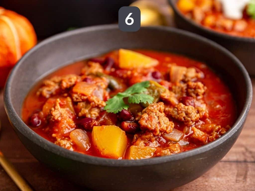 Vegan Pumpkin Chili Step 6 - serve with cilantro.
