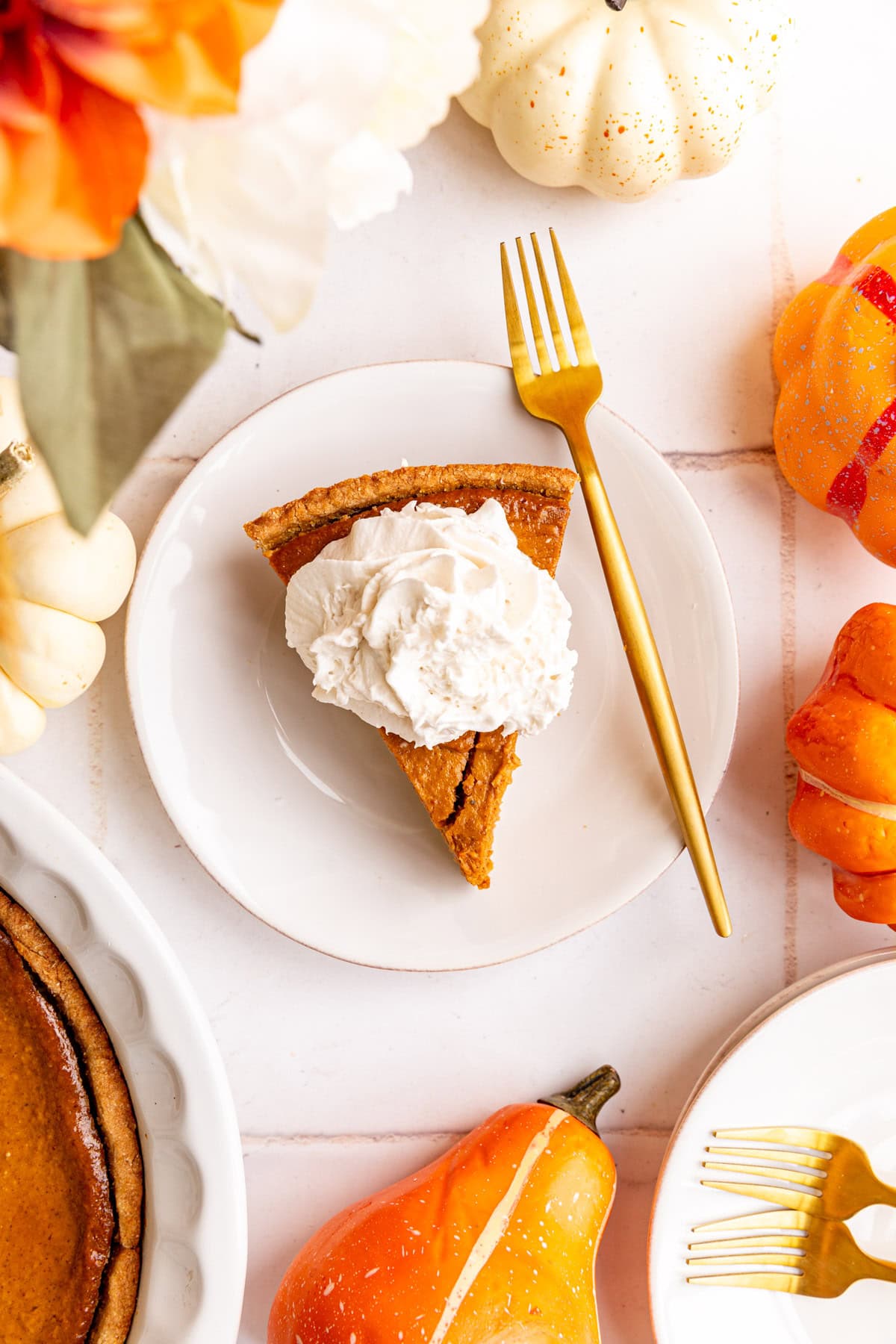 A plate of vegan pumpkin pie, with a fork, ready to eat.