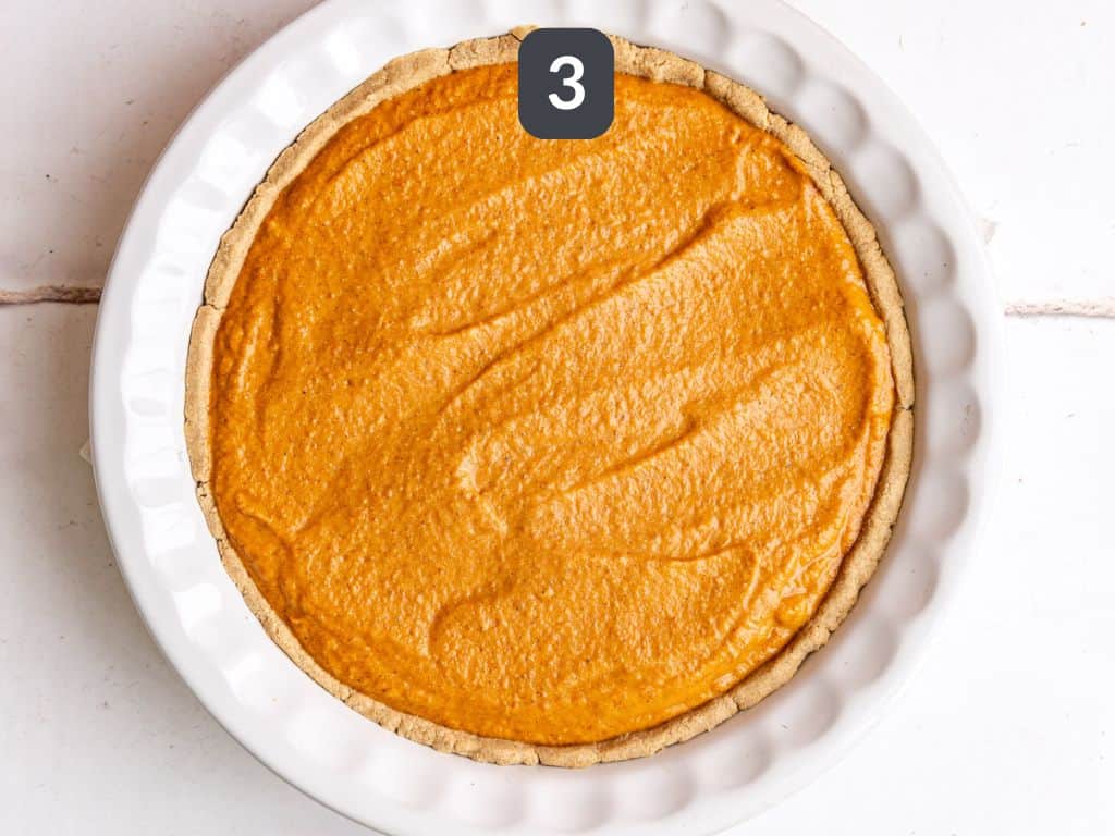 Vegan pumpkin pie step 3 - pour the filling into the crust.