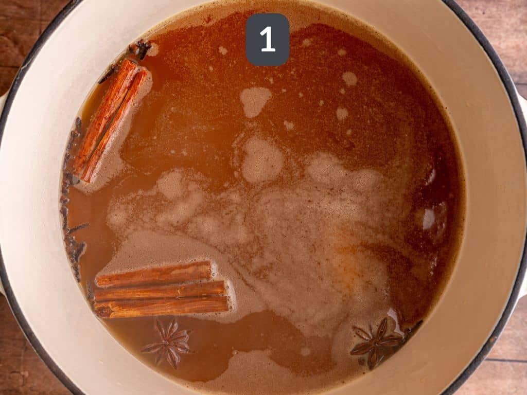 Thanksgiving Mocktail Step 1 - heat the cider and spices.