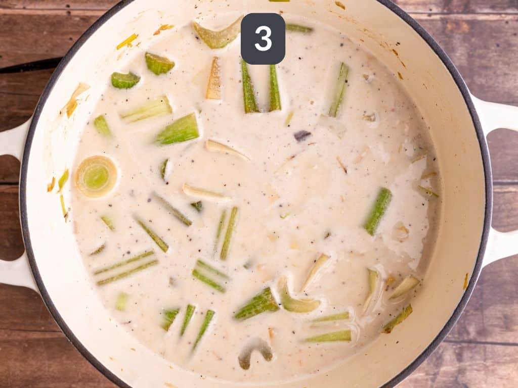 Vegan Celery Soup Step 3 - add the cream and broth, and simmer.