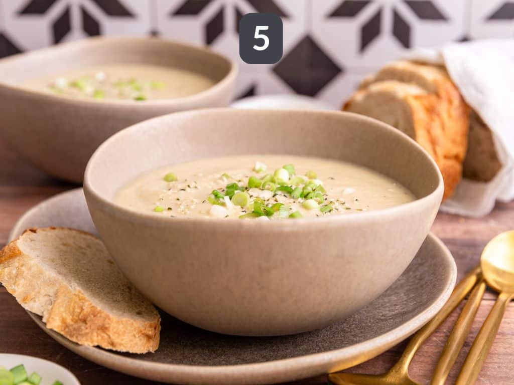 Vegan Celery Soup Step 5 - serve with a garnish of scallions and hemp seeds.