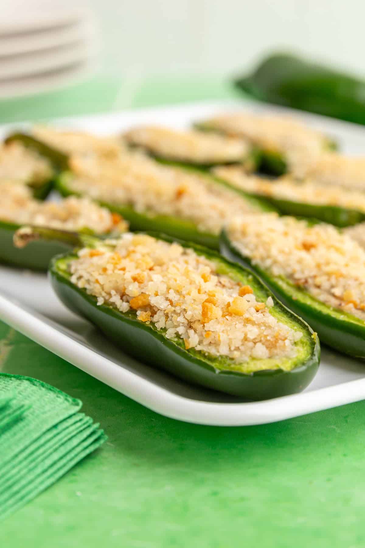 A jalapeño popper sitting on a tray.