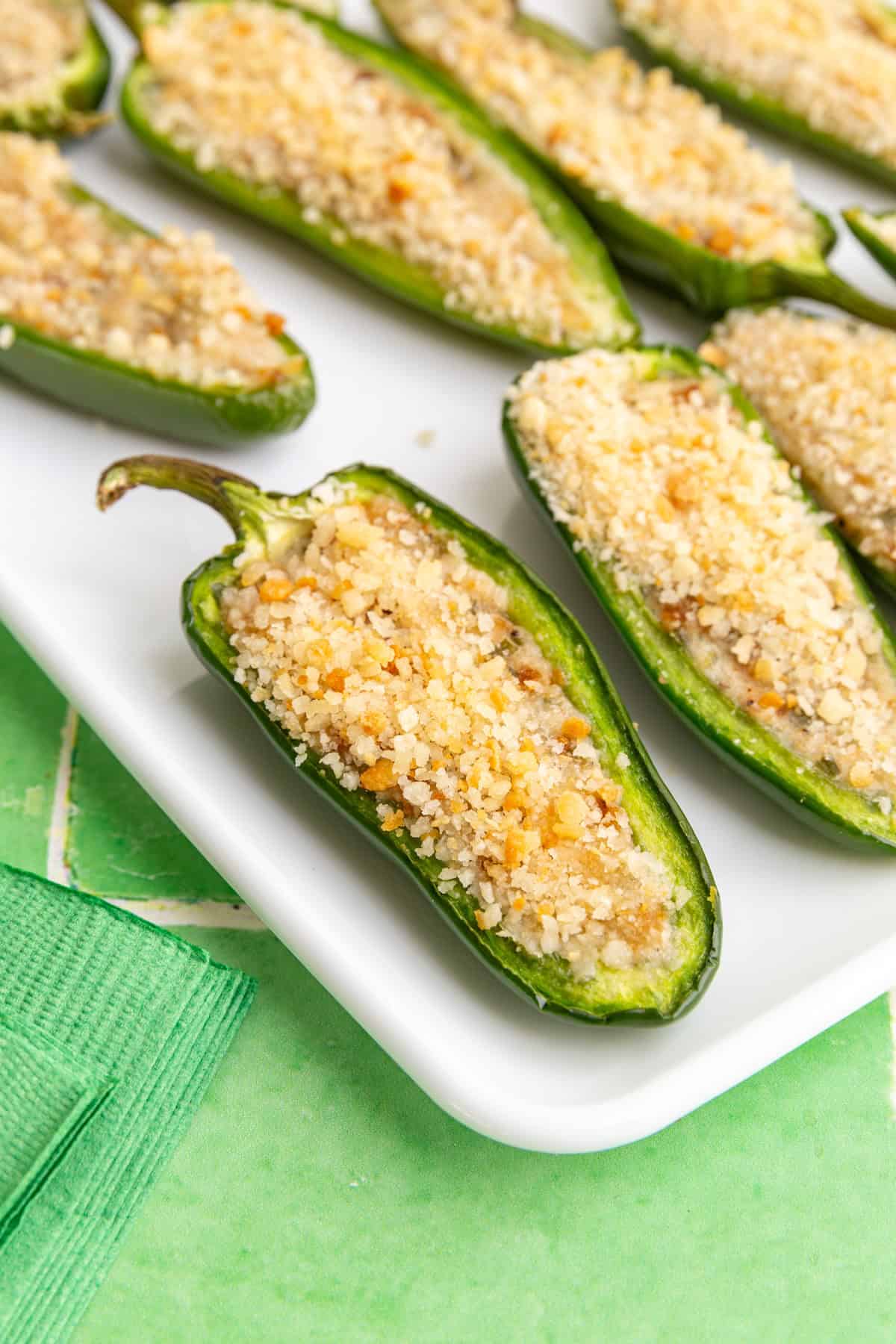 A jalapeño popper sitting on a tray.