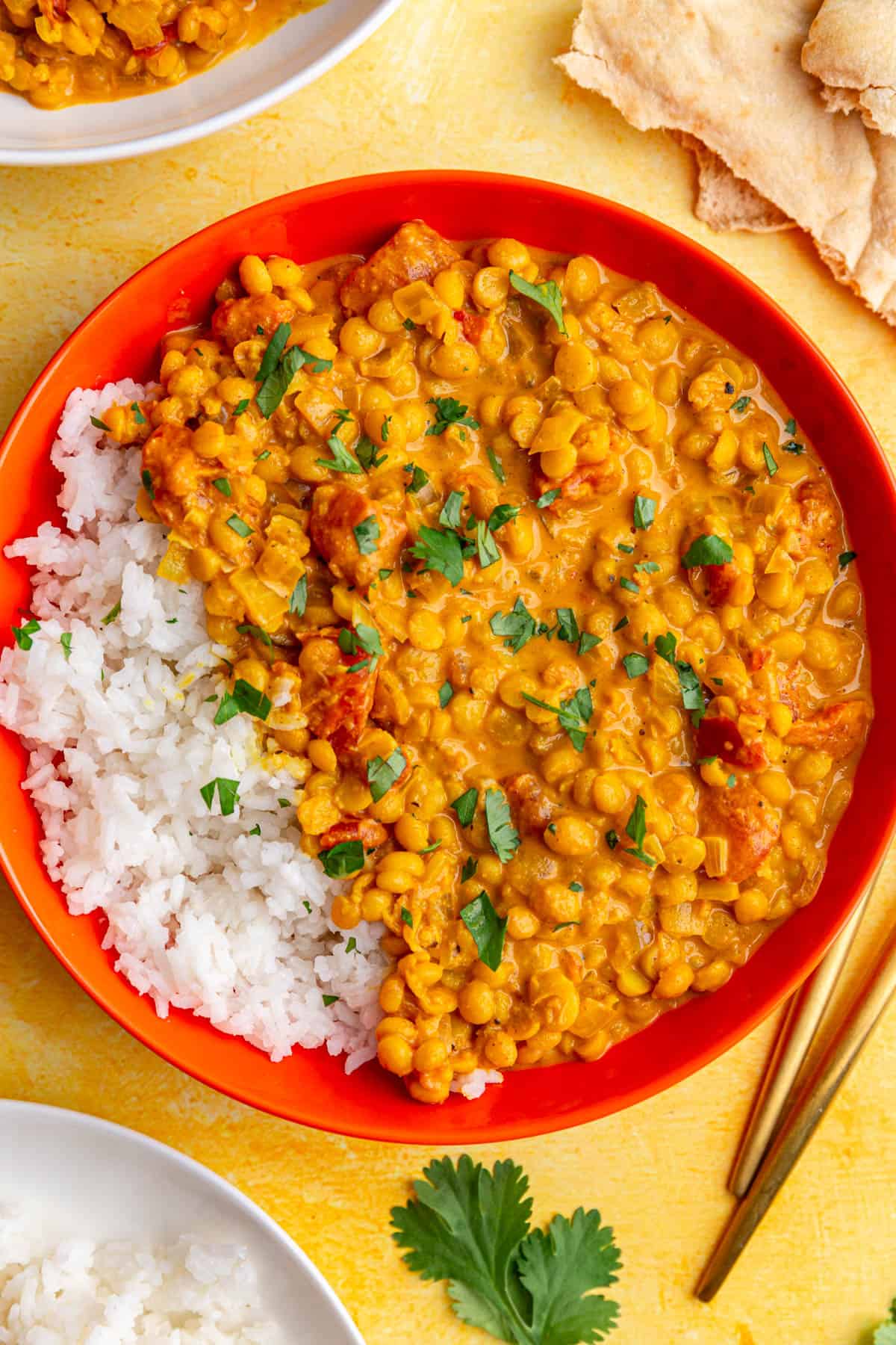 A bowl of white rice and chickpea dal.
