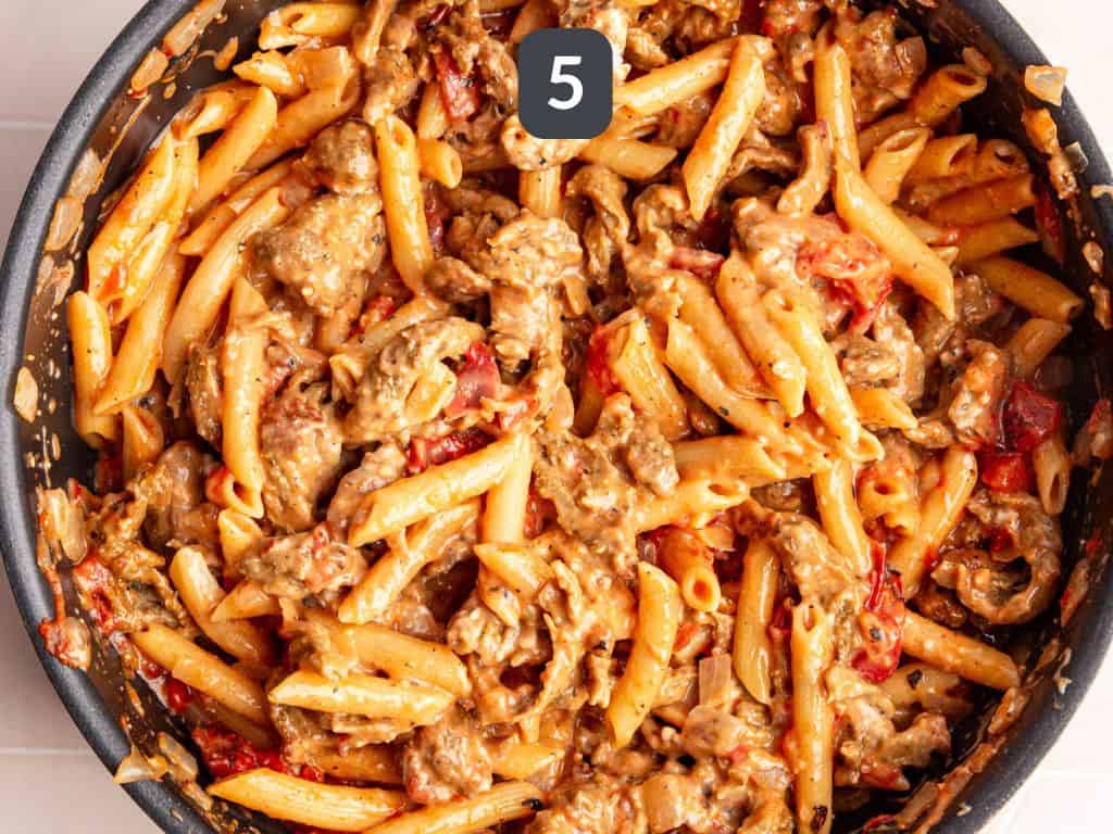 Vegan Cajun Chicken Pasta Step 5 - stir in the chicken and cream cheese.